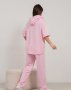 Рожевий трикотажний костюм з тасьмами (3)