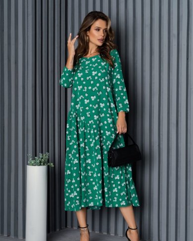 Зелена вільна сукня з діагональним воланом - SvitStyle