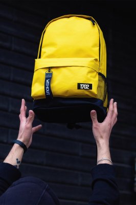 Маленький рюкзак міський жовтого кольору із зовнішньою кишенею на замку Without  - 7707041 - SvitStyle
